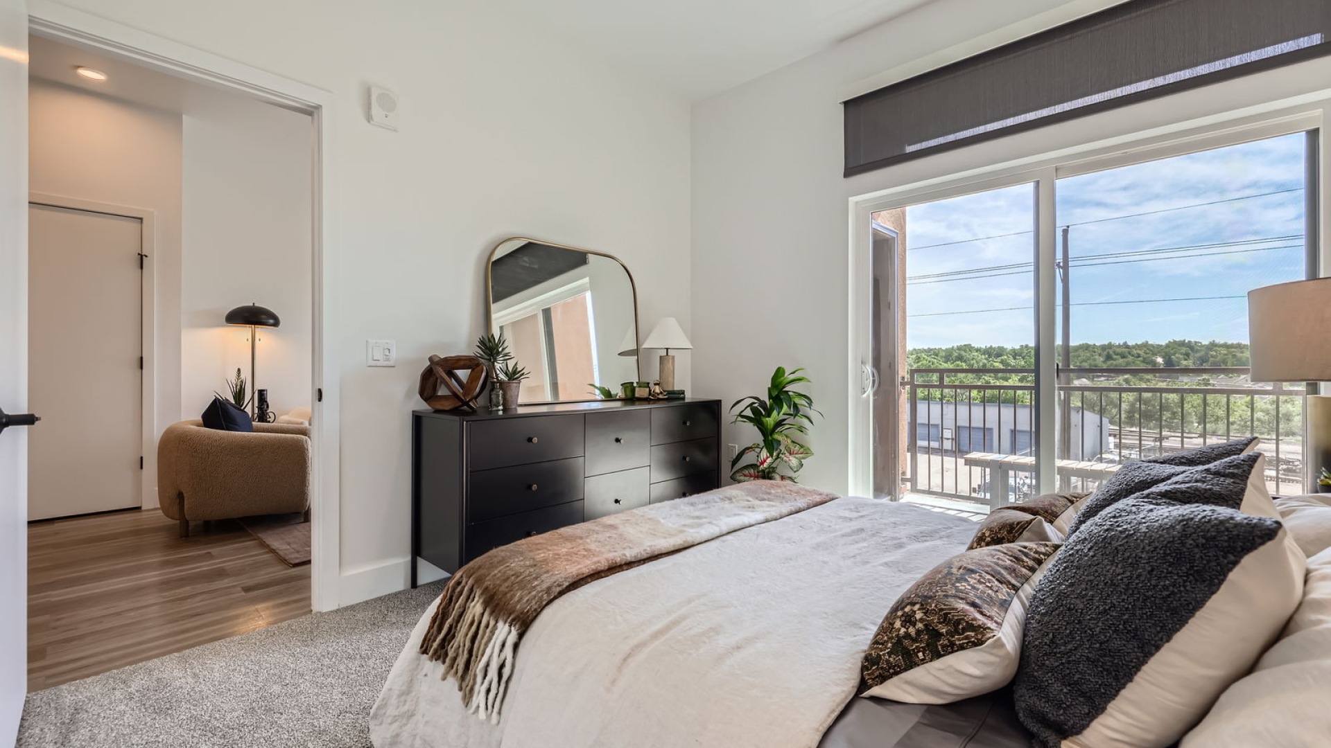 bedroom with bed art and window
