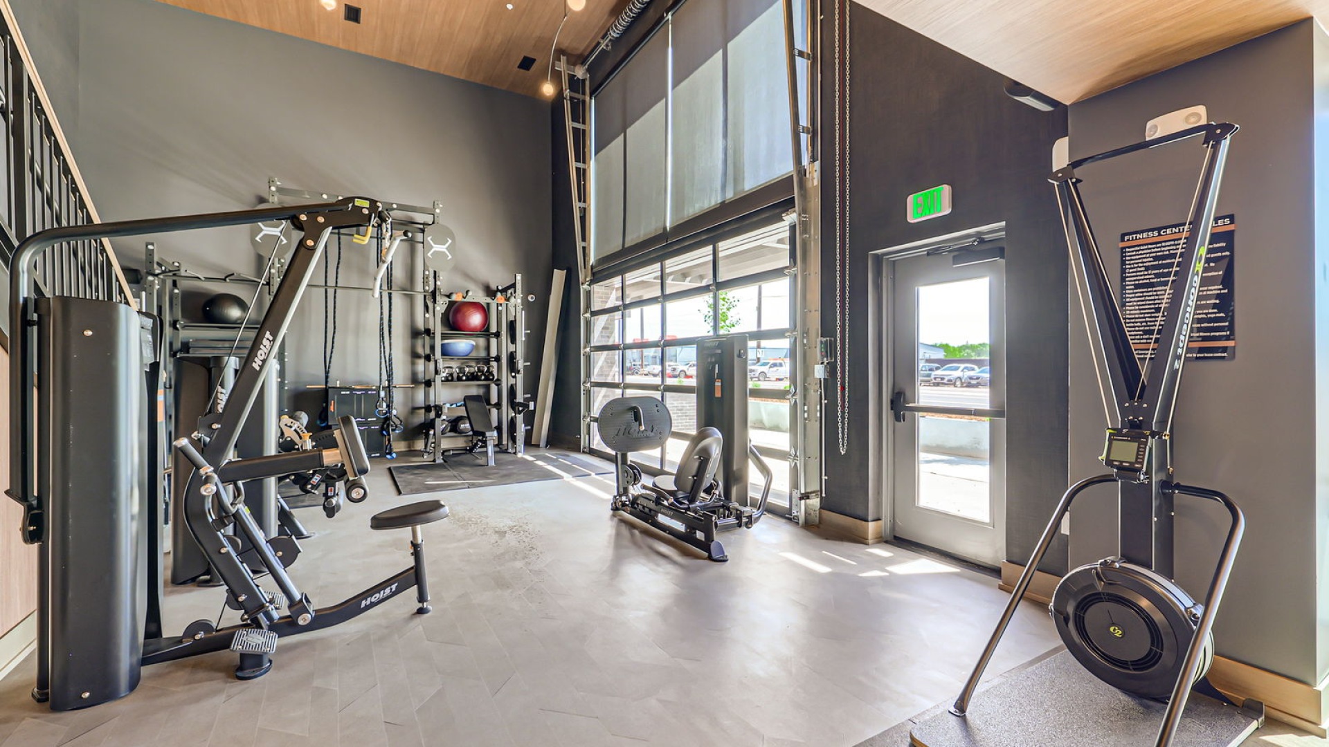 fitness center equipment beside bright windows